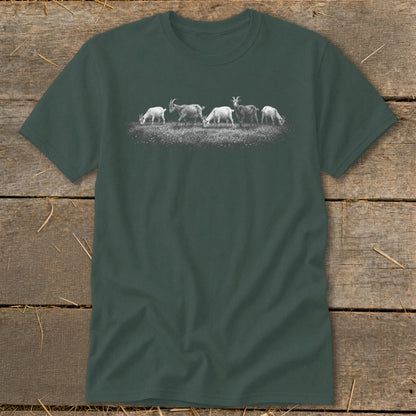 T-shirt with a graphic of five goats grazing on a grassy hill.