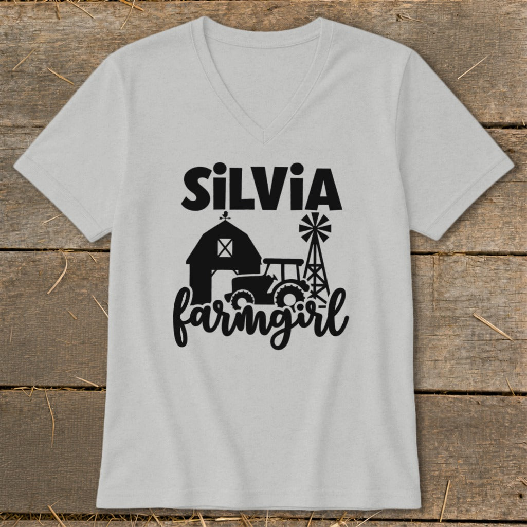 Light grey v-neck t-shirt with black farm graphic and "Silvia farmingirl" text.