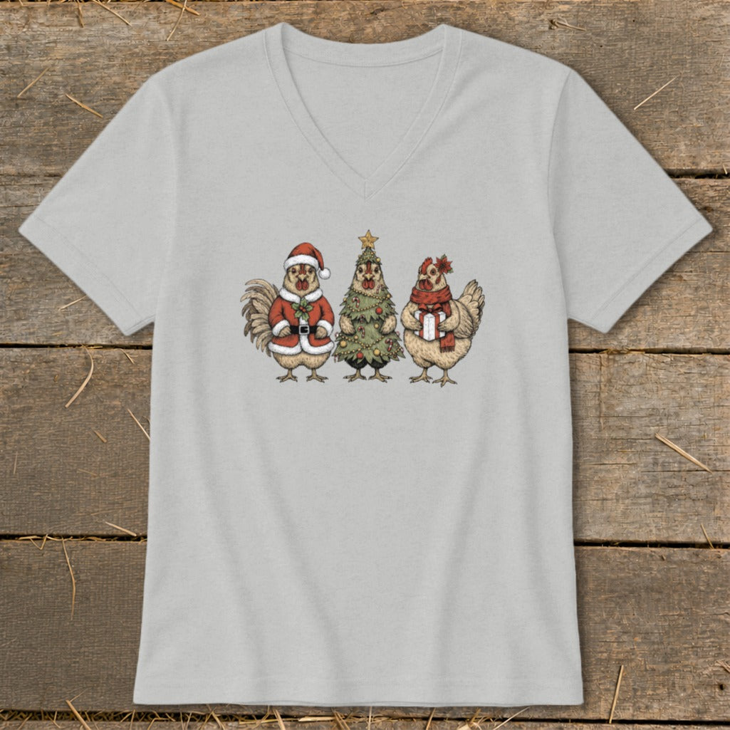 Three cartoon chickens celebrate Christmas, with one in a Santa suit.