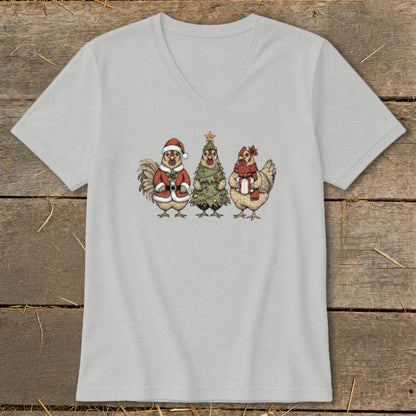 Three cartoon chickens celebrate Christmas, with one in a Santa suit.