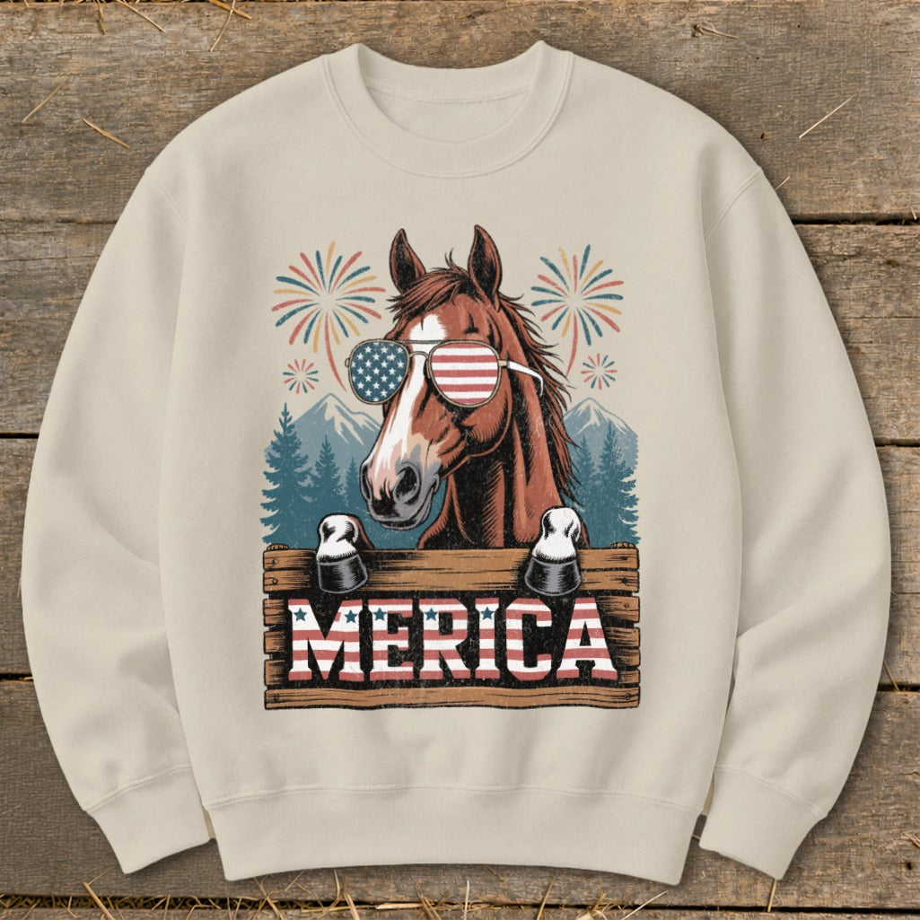 Horse wearing American flag sunglasses with "MERICA" text and fireworks.