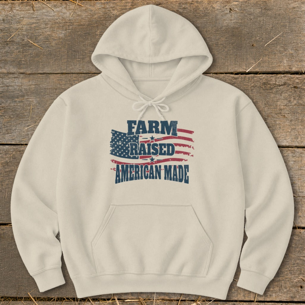 Cream hoodie with "FARM RAISED AMERICAN MADE" text over an American flag graphic.