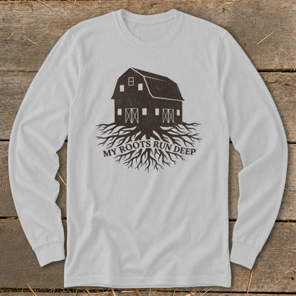 White long-sleeve t-shirt with barn and roots graphic and text "MY ROOTS RUN DEEP".