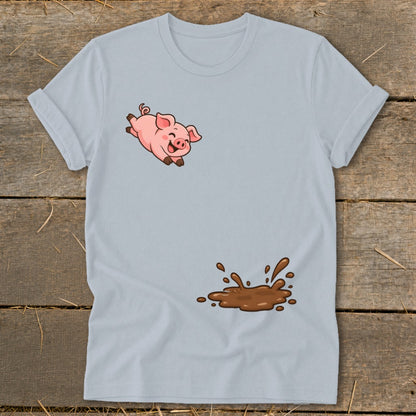 Light blue t-shirt with a cartoon pig jumping above a brown mud splash.