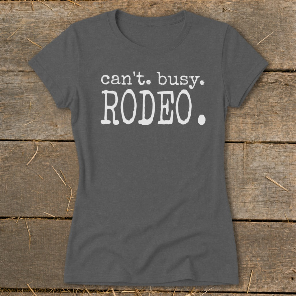 Grey t-shirt with white text reading "can't. busy. RODEO."