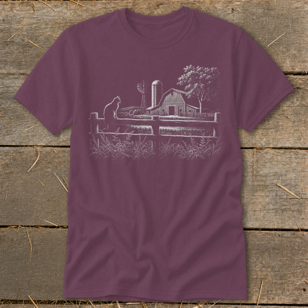 T-shirt with white sketch of cat on fence, barn, windmill, and tree.
