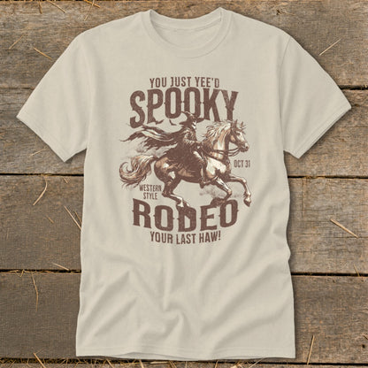 T-shirt graphic with cowboy riding horse, "Spooky Rodeo" text, and "Oct 31".