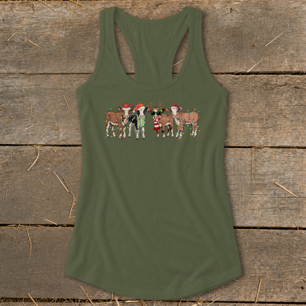 Cute cows wearing Santa hats and Christmas lights on a green tank top.