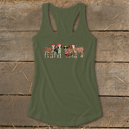Cute cows wearing Santa hats and Christmas lights on a green tank top.