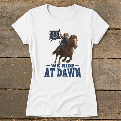 Cat on horseback wearing bandana and holding a torn blue flag with a horseshoe logo. Text reads "WE RIDE AT DAWN."