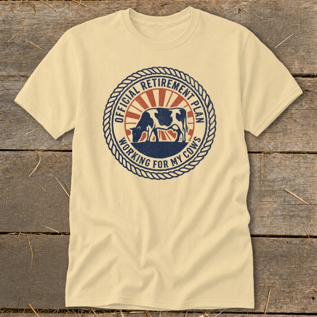 Cream t-shirt with "Official Retirement Plan Working For My Cows" circular graphic.