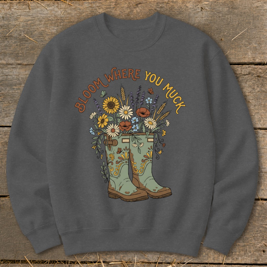Green boots overflowing with flowers and text "BLOOM WHERE YOU MUCK."