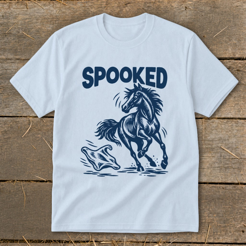 Light blue t-shirt with "SPOOKED" text above a startled horse and a ghost graphic.