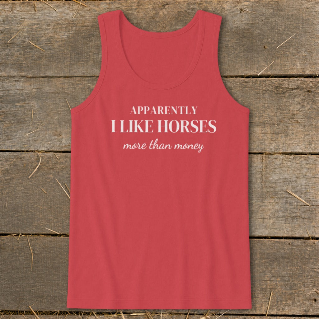 Coral tank top with white text: "APPARENTLY I LIKE HORSES more than money."