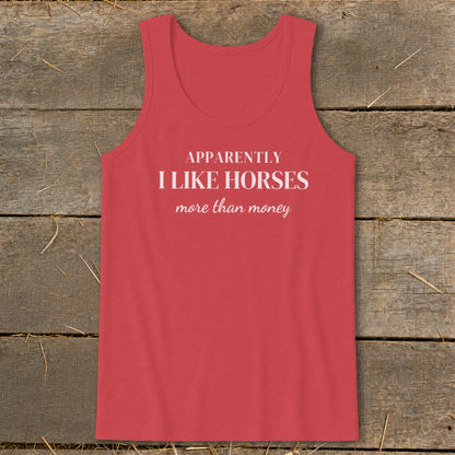 Coral tank top with white text: "APPARENTLY I LIKE HORSES more than money."