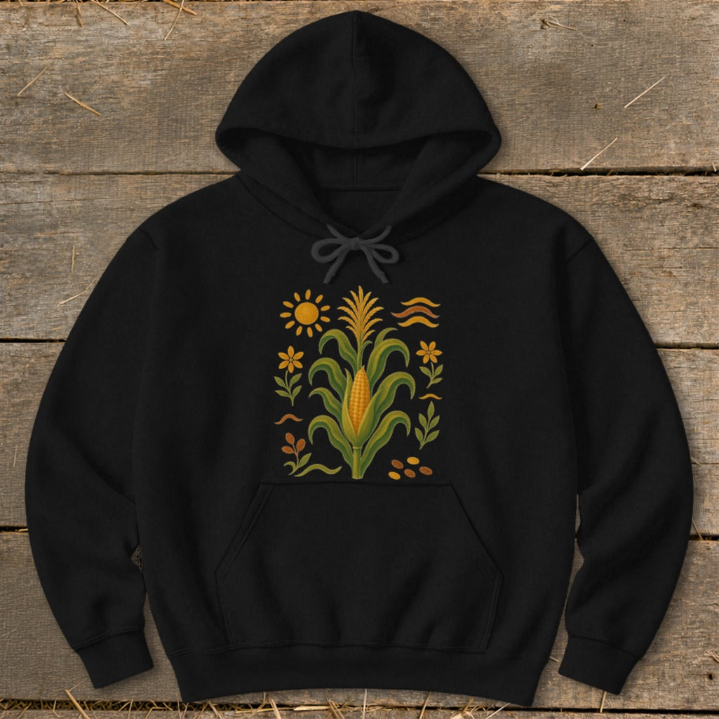 Black hoodie with a central corn stalk design, sun, and decorative elements.