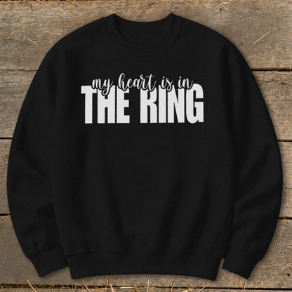 Black sweatshirt with white text "my heart is in THE RING"