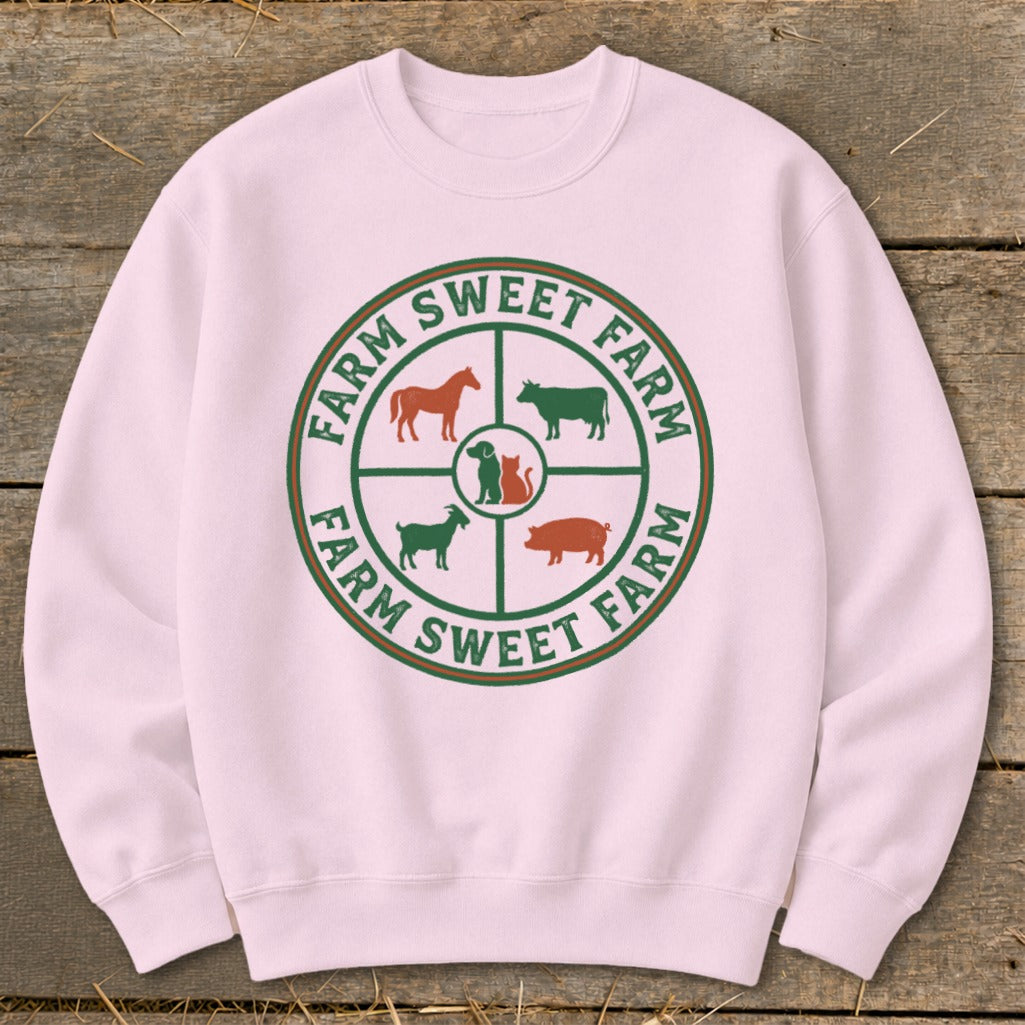 Pink sweatshirt with a circular farm animal graphic and "Farm Sweet Farm" text.