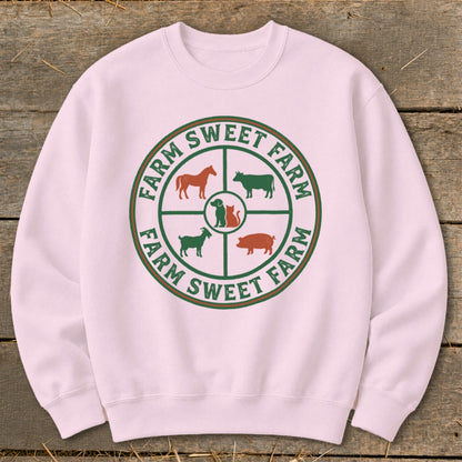 Pink sweatshirt with a circular farm animal graphic and "Farm Sweet Farm" text.