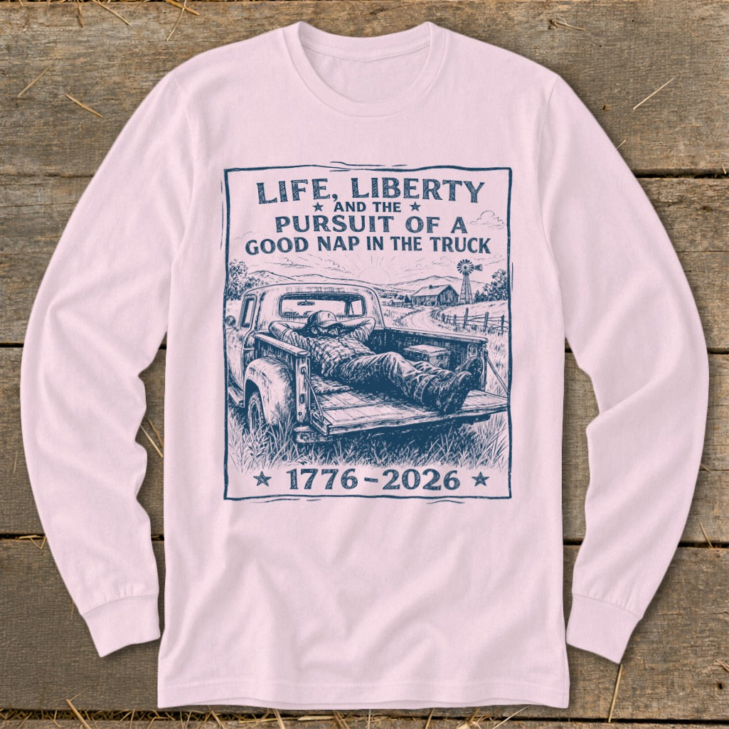 Graphic tee with text "Life, Liberty and the Pursuit of a Good Nap in the Truck" and "1776-2026".