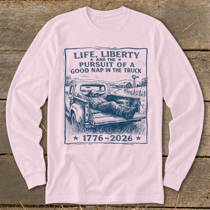 Graphic tee with text "Life, Liberty and the Pursuit of a Good Nap in the Truck" and "1776-2026".