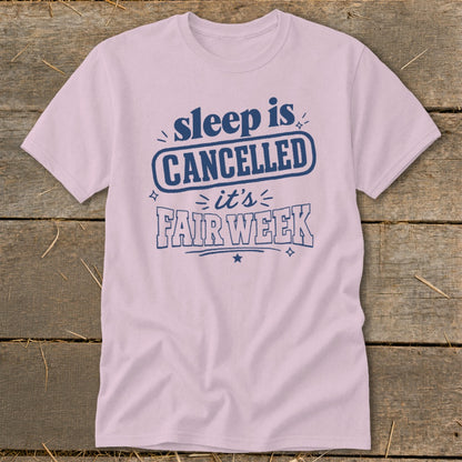 Pink t-shirt with blue text: "sleep is CANCELLED it's FAIR WEEK"
