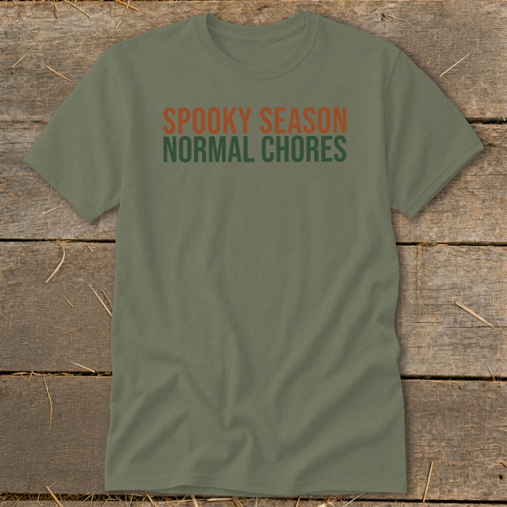 Olive t-shirt with orange text "SPOOKY SEASON" and green text "NORMAL CHORES".