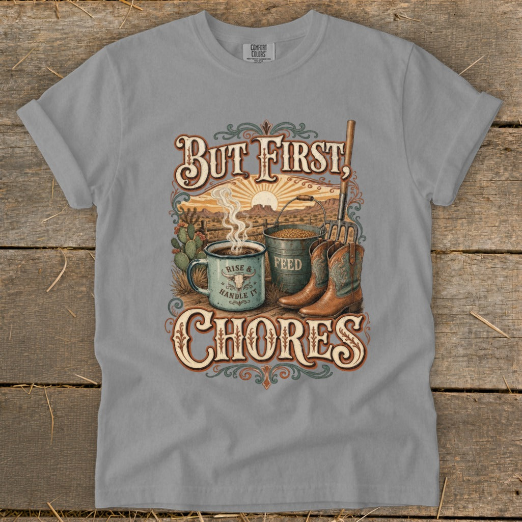 Grey t-shirt with "But First, CHORES" design featuring coffee, feed bucket, and cowboy boots.