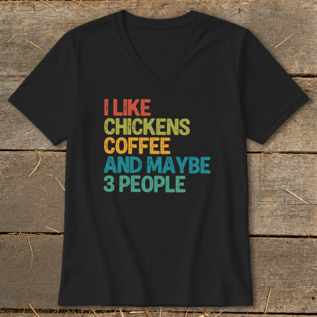 Black v-neck t-shirt with colorful text: I LIKE CHICKENS COFFEE AND MAYBE 3 PEOPLE.