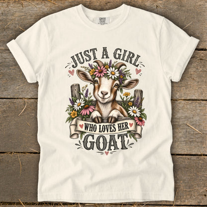 White t-shirt with a goat wearing a flower crown and the text "Just a girl who loves her goat".