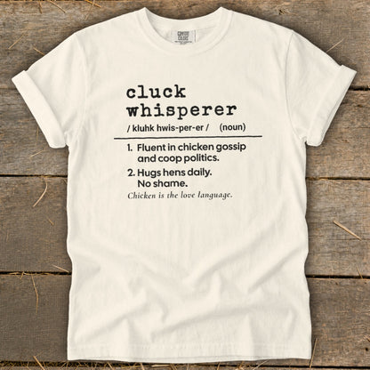 White t-shirt with "cluck whisperer" definition and chicken love language text.