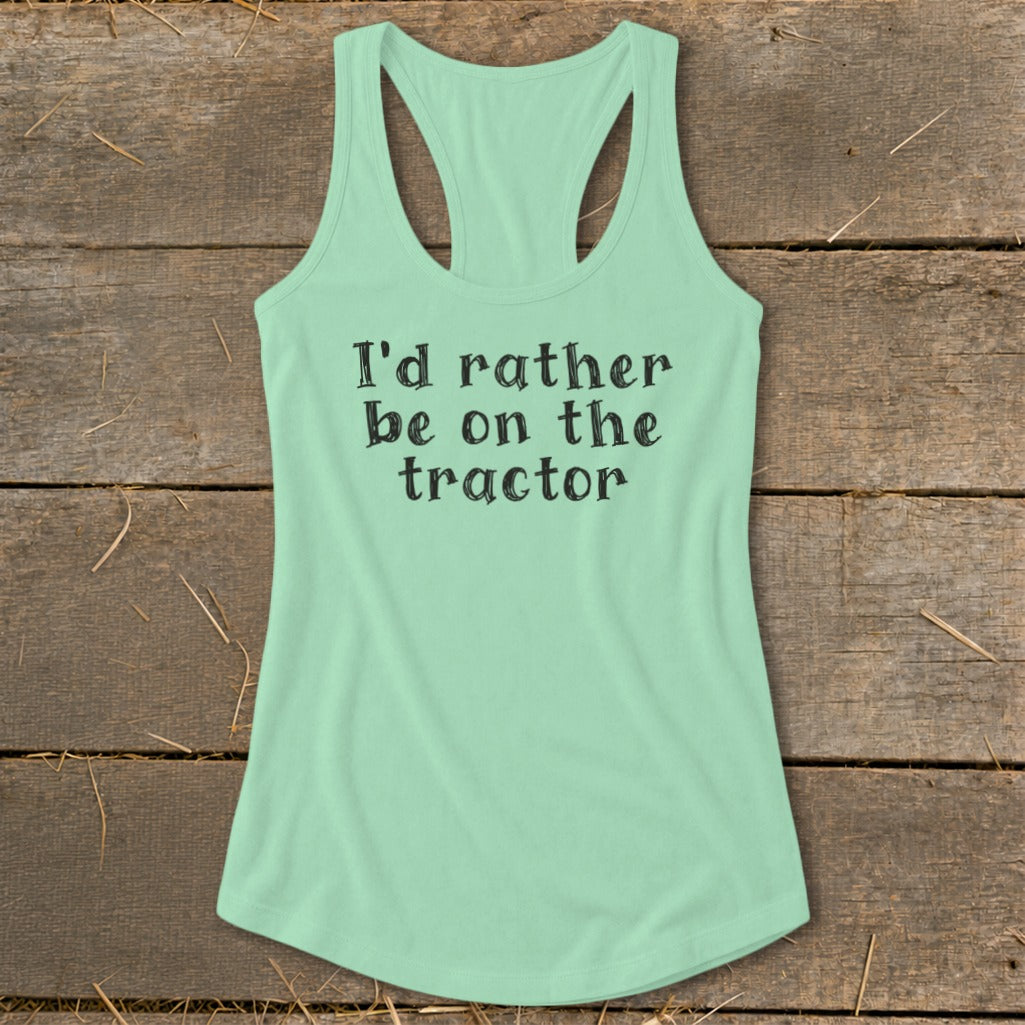 Mint green racerback tank top with black text that reads "I'd rather be on the tractor."
