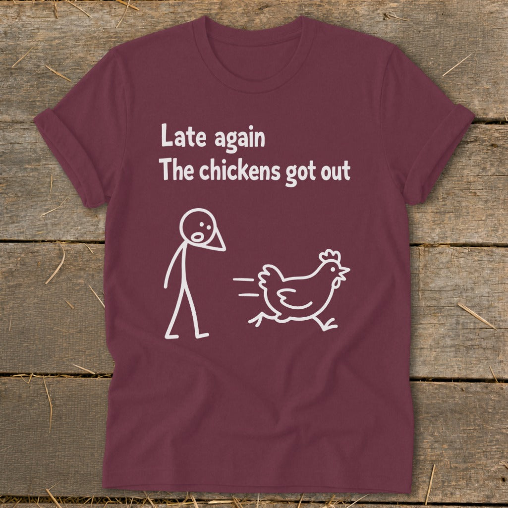 Maroon t-shirt with white text and illustration of a stick figure and chicken.