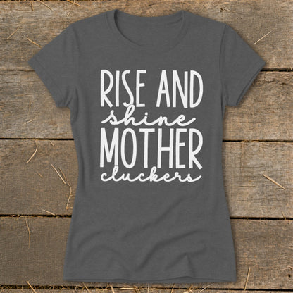 Grey t-shirt with white text reading "RISE AND shine MOTHER cluckers."
