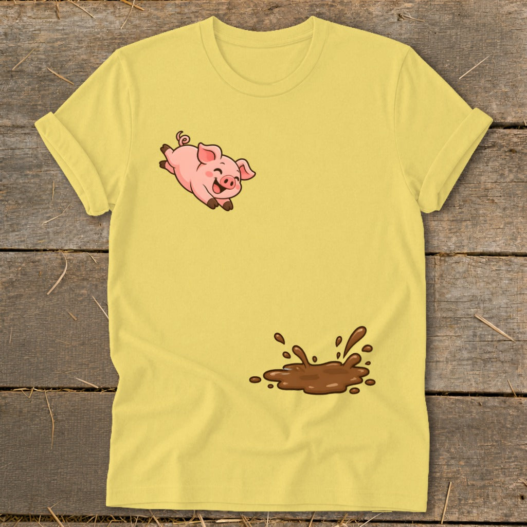 Yellow t-shirt with cartoon pig jumping into a mud puddle graphic.