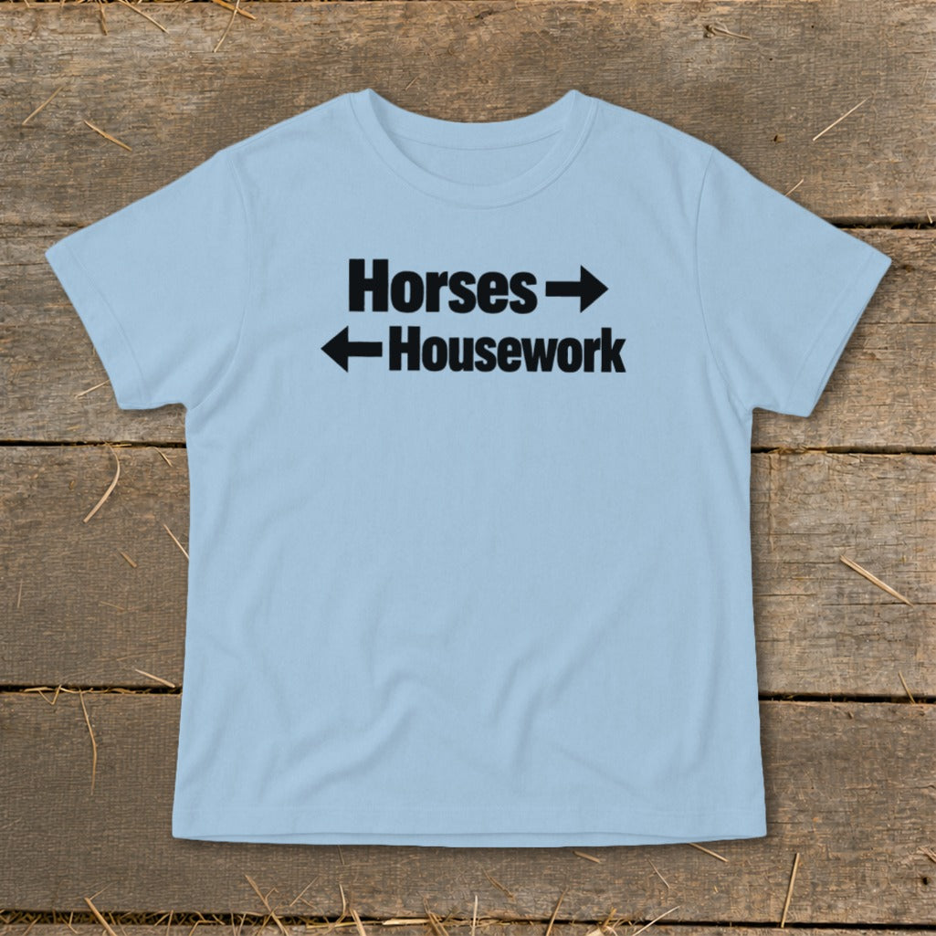 Light blue t-shirt featuring the black text Horses pointing right and Housework pointing left.