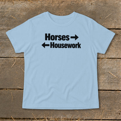 Light blue t-shirt featuring the black text Horses pointing right and Housework pointing left.