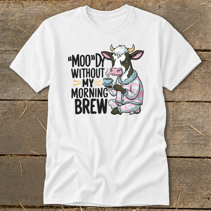 Cow in pajamas holding coffee with text "Moo"dy Without My Morning Brew.