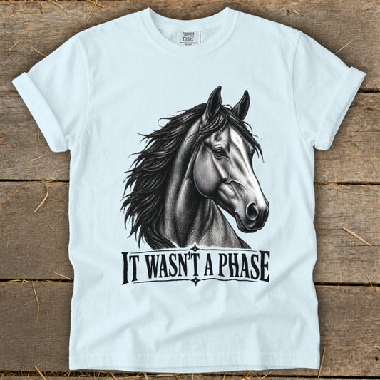 White t-shirt with black sketch of a horse's head and text "IT WASN'T A PHASE".