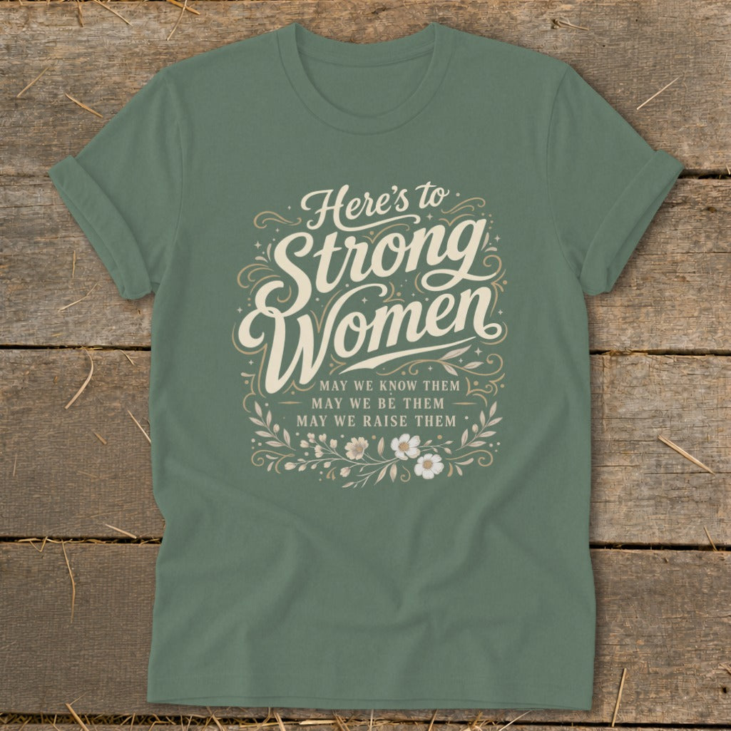 Green t-shirt with "Here's to Strong Women" and floral design.