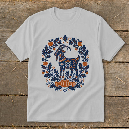 Light gray short-sleeve t-shirt featuring a folk art goat surrounded by an autumn leaf wreath.