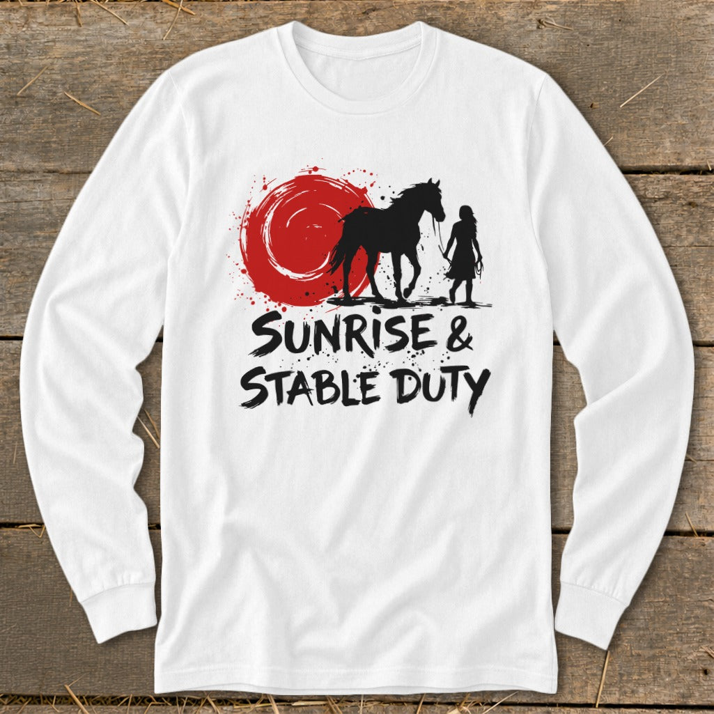 White long-sleeved shirt with black graphic of a horse, person, and red sun, text reads "Sunrise & Stable Duty."