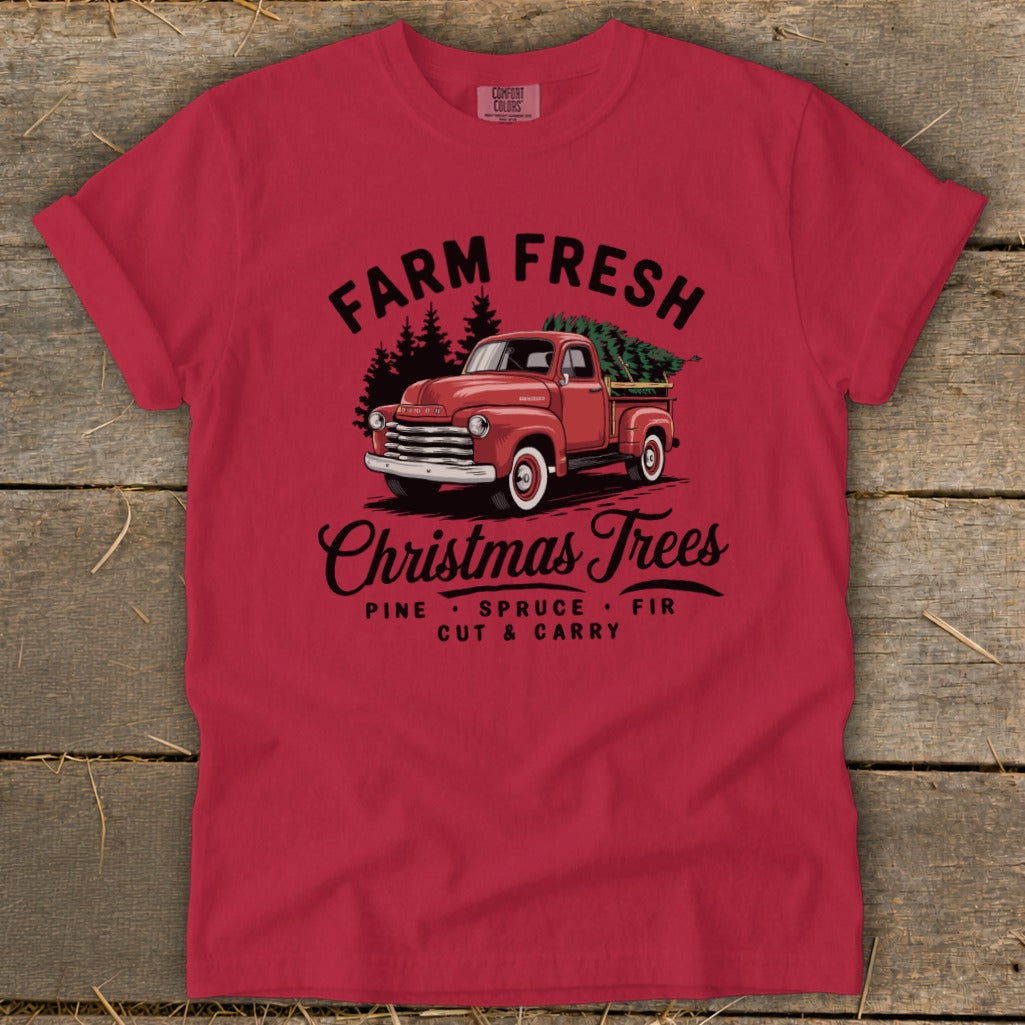 Red t-shirt with "Farm Fresh Christmas Trees" text and vintage truck graphic.