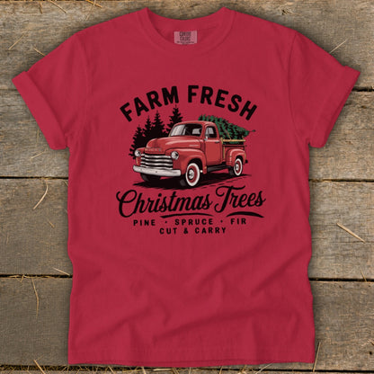 Red t-shirt with "Farm Fresh Christmas Trees" text and vintage truck graphic.