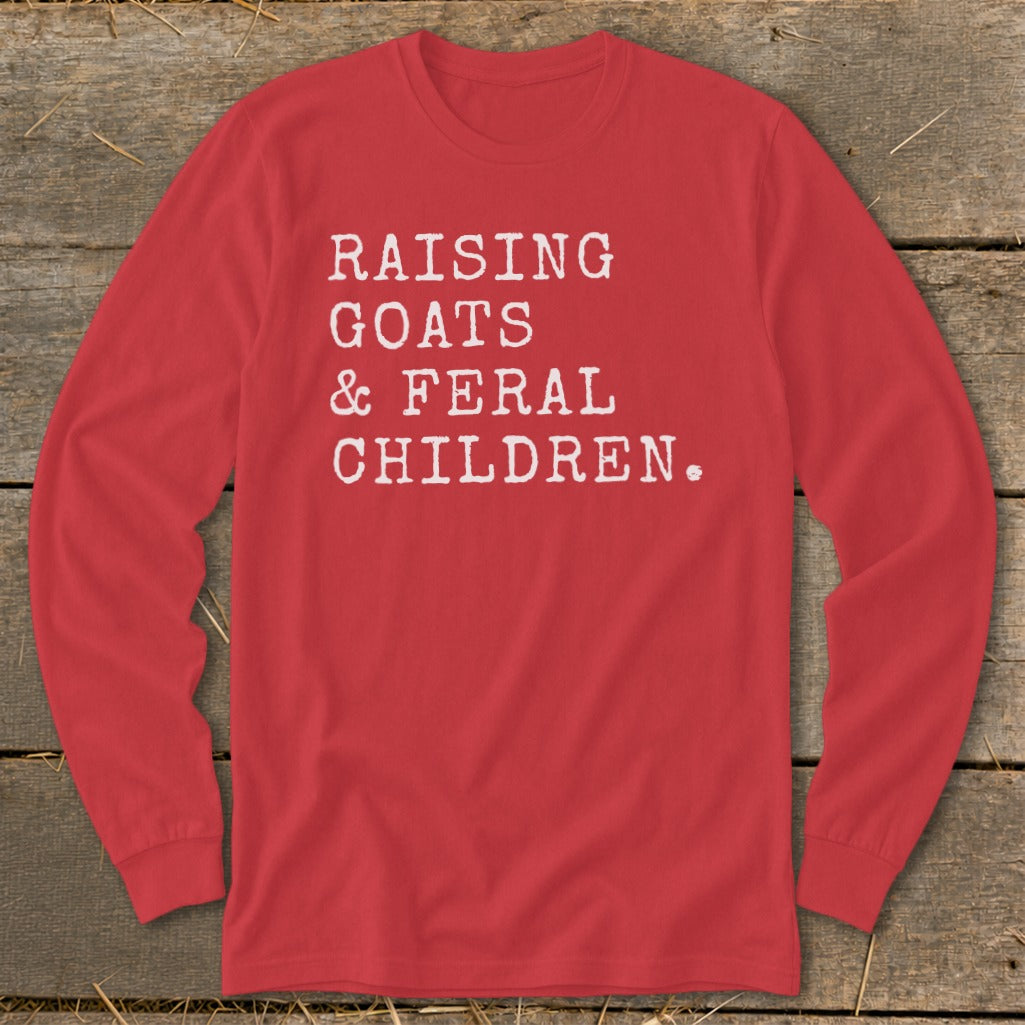 Red long-sleeve shirt with white text "RAISING GOATS & FERAL CHILDREN."