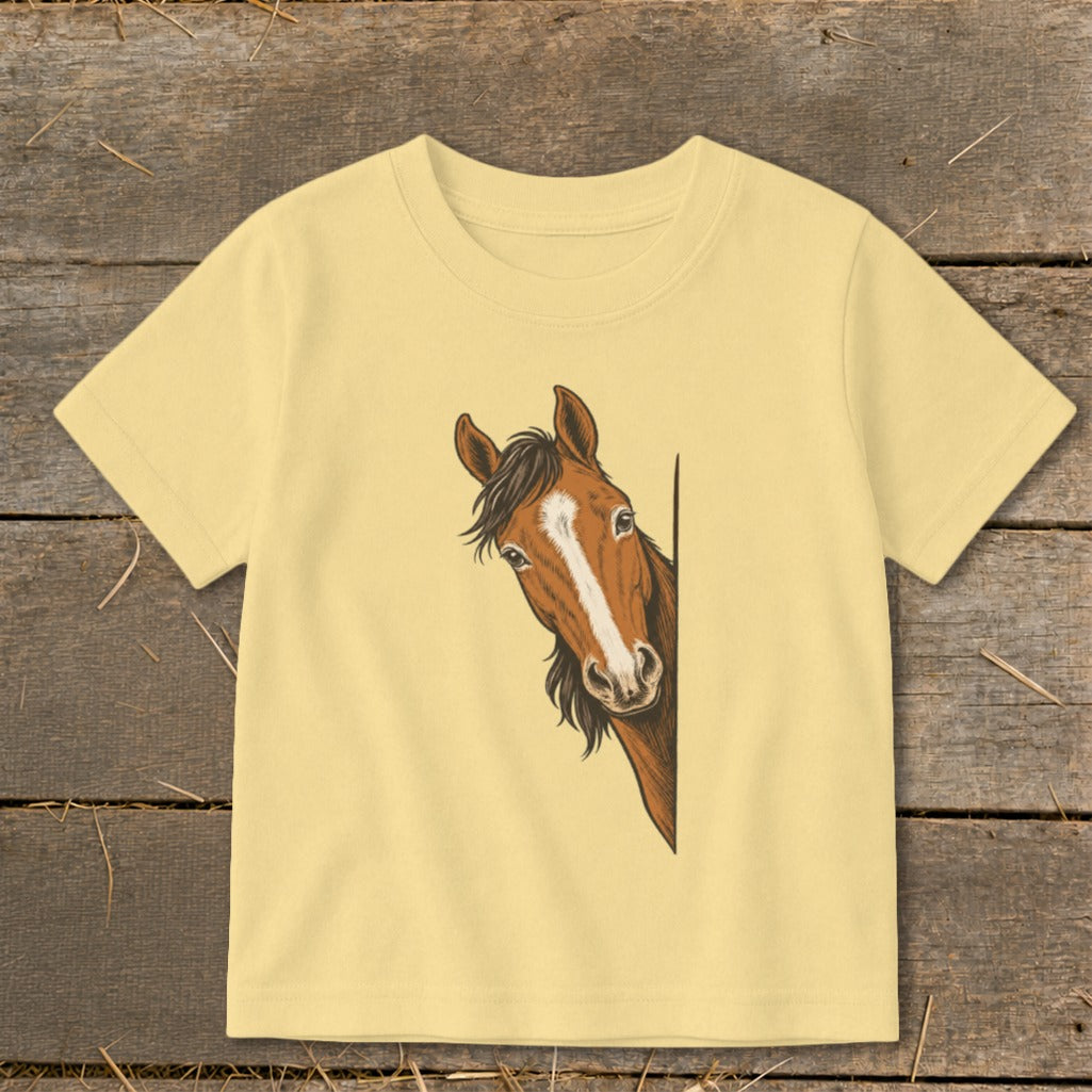 Yellow t-shirt with illustration of a brown horse peeking from the right side.