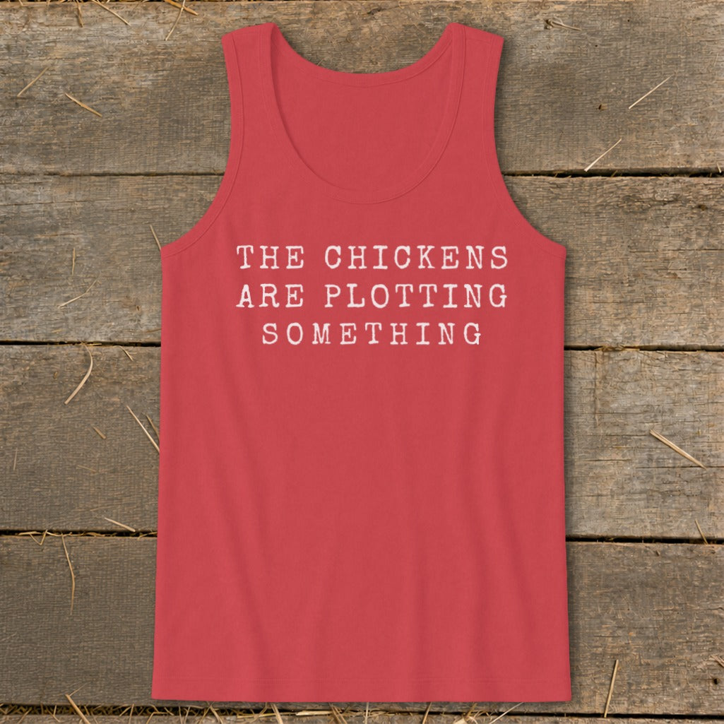 Red tank top with white text reading "THE CHICKENS ARE PLOTTING SOMETHING".