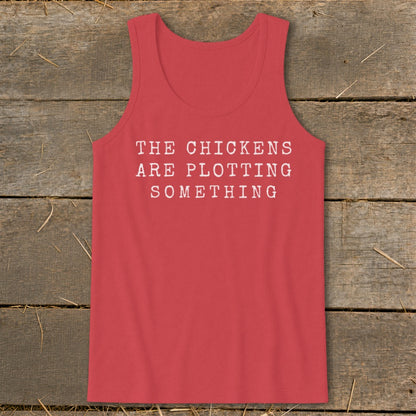 Red tank top with white text reading "THE CHICKENS ARE PLOTTING SOMETHING".