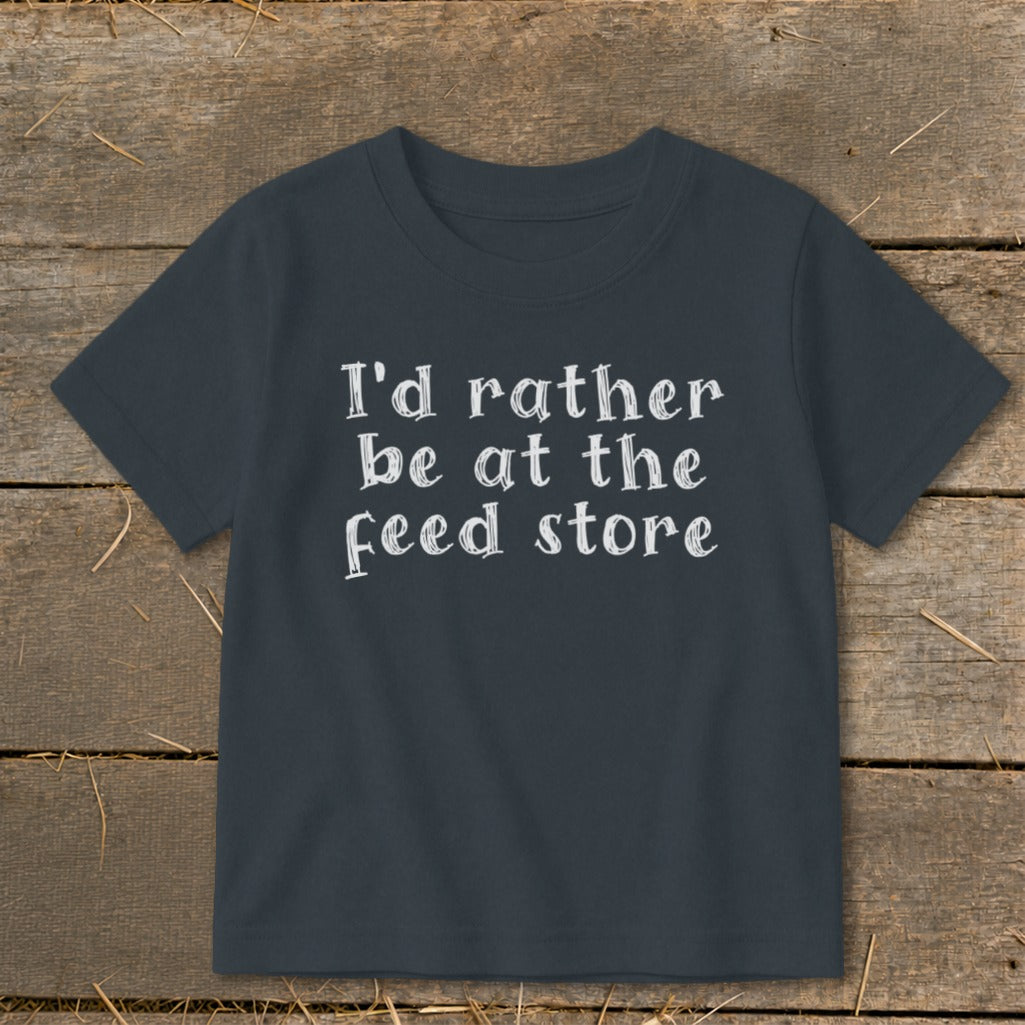 Dark grey t-shirt with white text that reads "I'd rather be at the feed store".