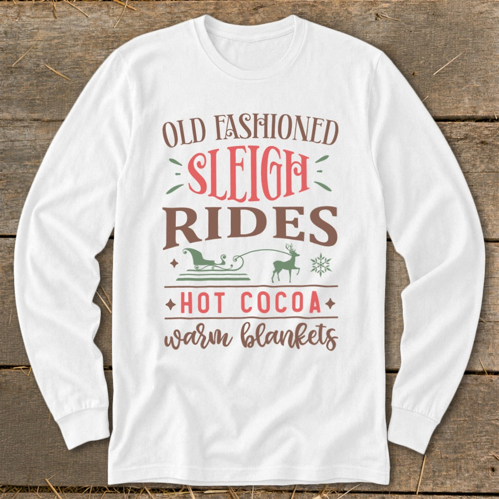 White long-sleeve shirt with "Old Fashioned Sleigh Rides Hot Cocoa Warm Blankets" text and graphics.